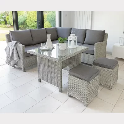 Palma mini corner set in white wash wicker with grey cushions in a conservatory