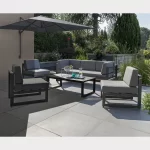 Versa corner lounge set with wall mounted parasol on a garden patio in the sun shine