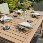 RHS Hampton 6 seat dining set wood table detail on a garden decking