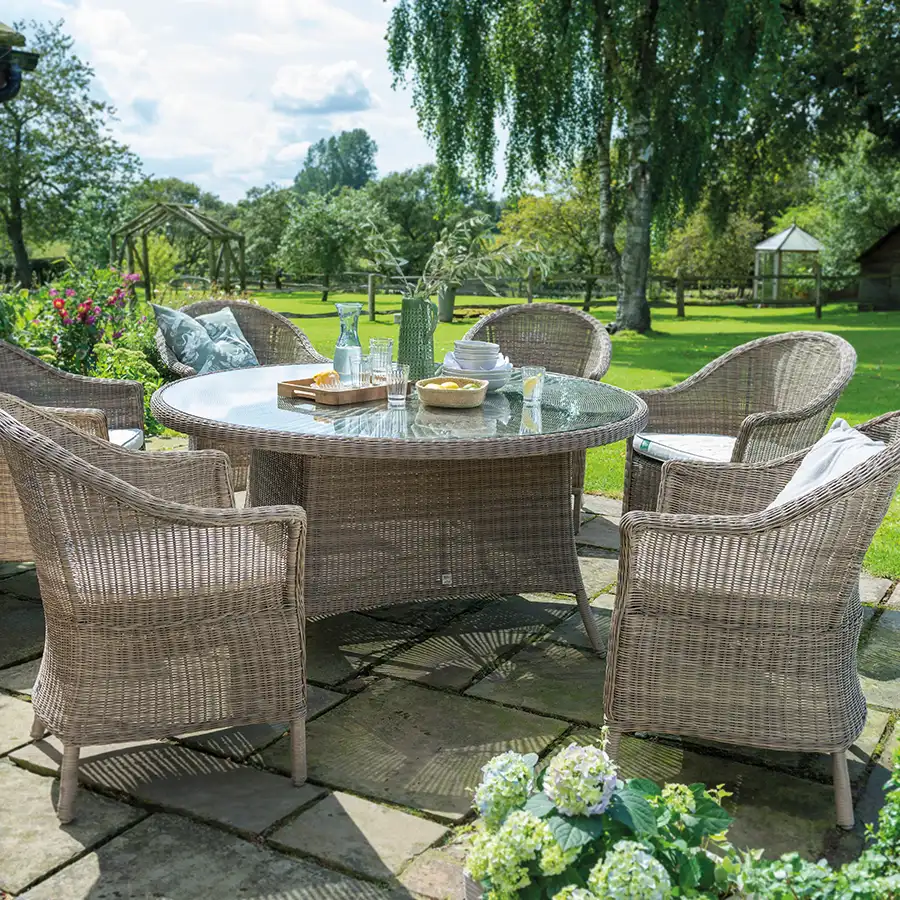 Harlow Carr 6 seat dining set on a garden terrace in the sunshine