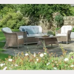 RHS Harlow Carr lounge set with 2 seater sofa on a garden patio with flowers