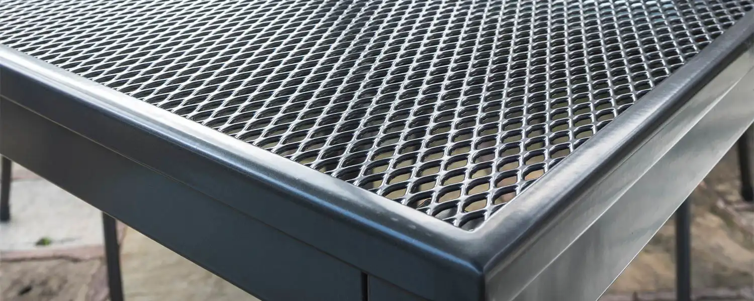 Close up of a metal mesh table top.