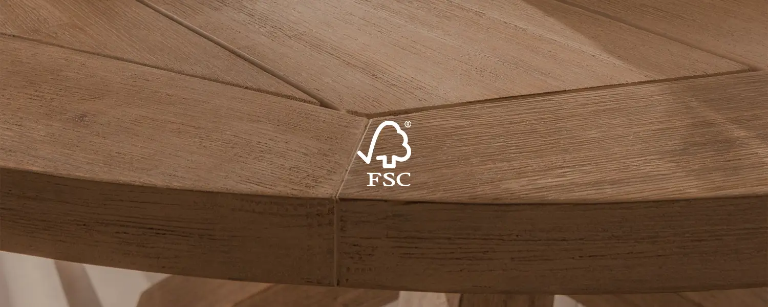 Close up of a wooden table top with the FSC logo.