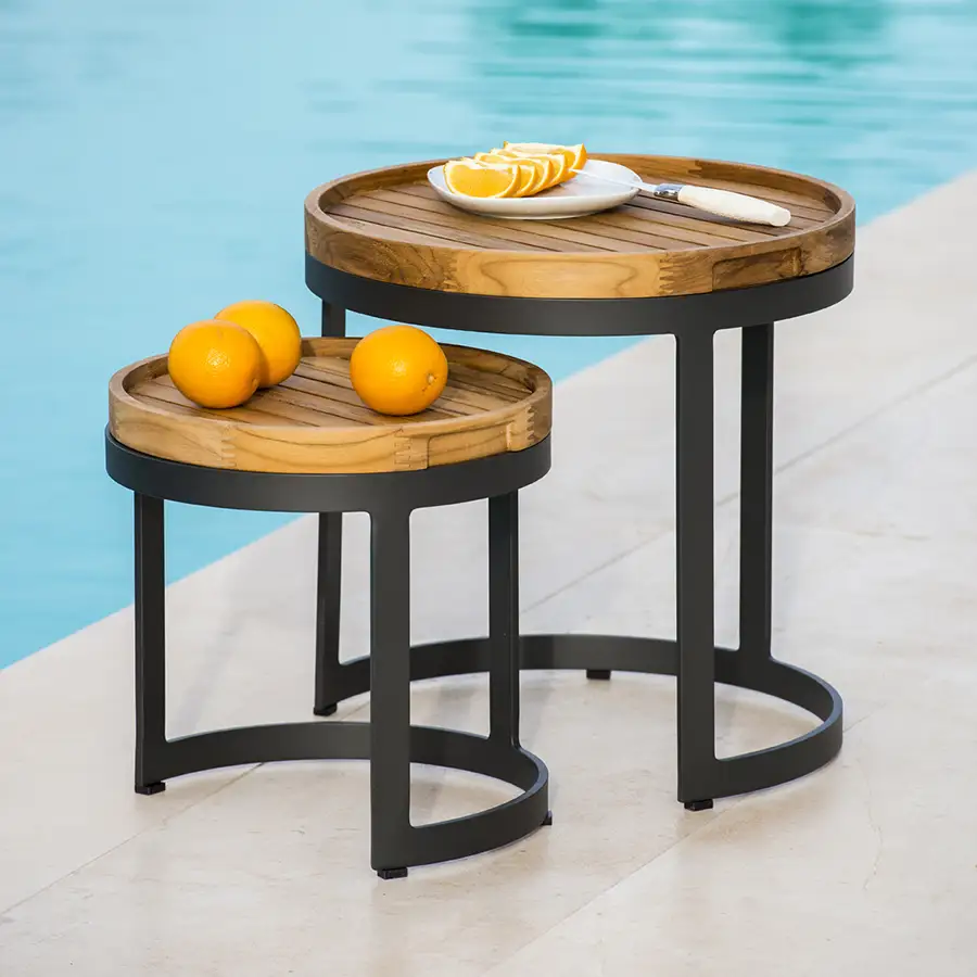 bertus side tables with fruit on next to outdoor pool