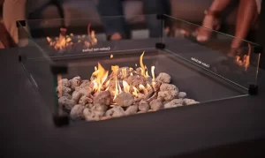Close up of flames on a fire pit table in the garden