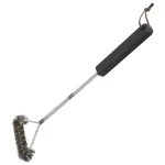 Side view of large grill brush on a white background