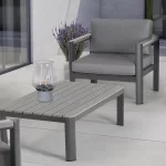 Gio Lounge Chair and coffee table on a white marble patio