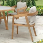 Kubu Dining Chairs on a garden patio in the sun shine