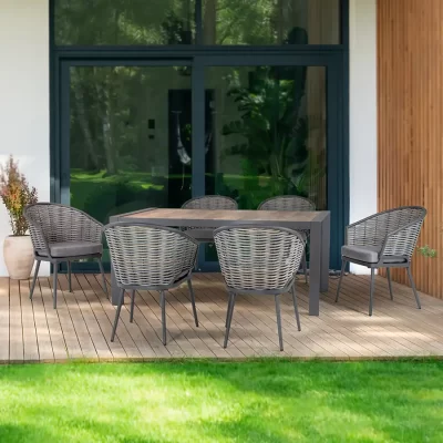 Malo 6 seat dining set on a wooden veranda outside a modern house