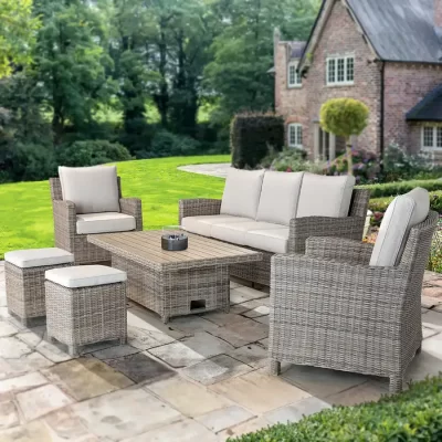 Palma Signature Sofa Set in Oyster with a Alu Slat top table in the down position in the beautiful garden of a country house