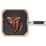 Cozze Reversible Cast Iron Pan with Bamboo Tray 330 x 330 mm with cooked steak